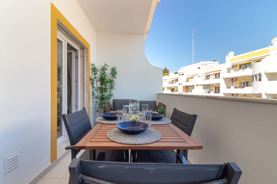 Outdoor dining and lounge area overlooking the village 