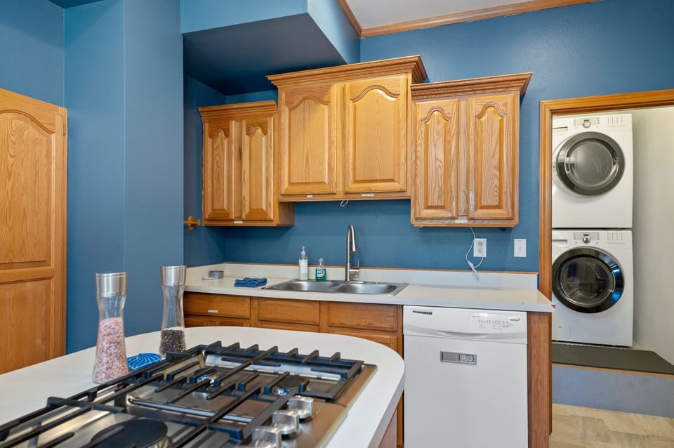 Kitchen with gas cooktop, laundry and dishwasher