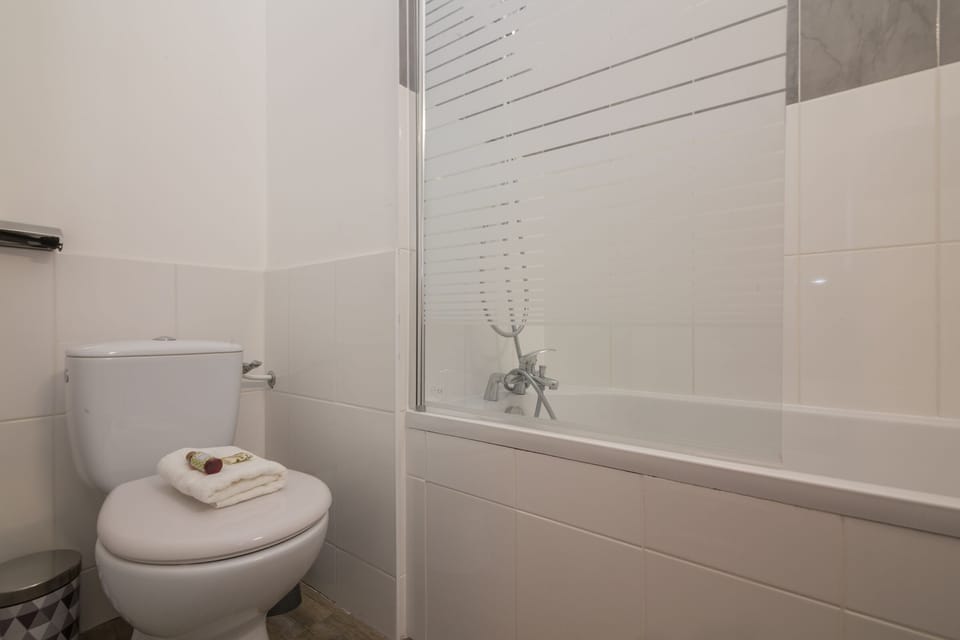 Bathroom with bath, sink and toilet