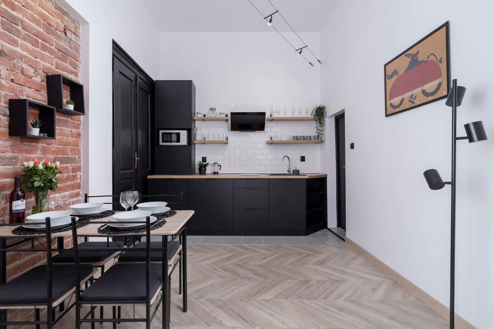 Fully equipped kitchenette with a dining area.