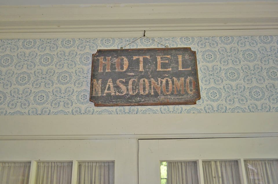 A sign in the foyer is a reminder of the home's history as a hotel.