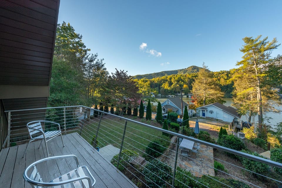 View of the lake & surrounding mountains from the private balcony with seating for 2.