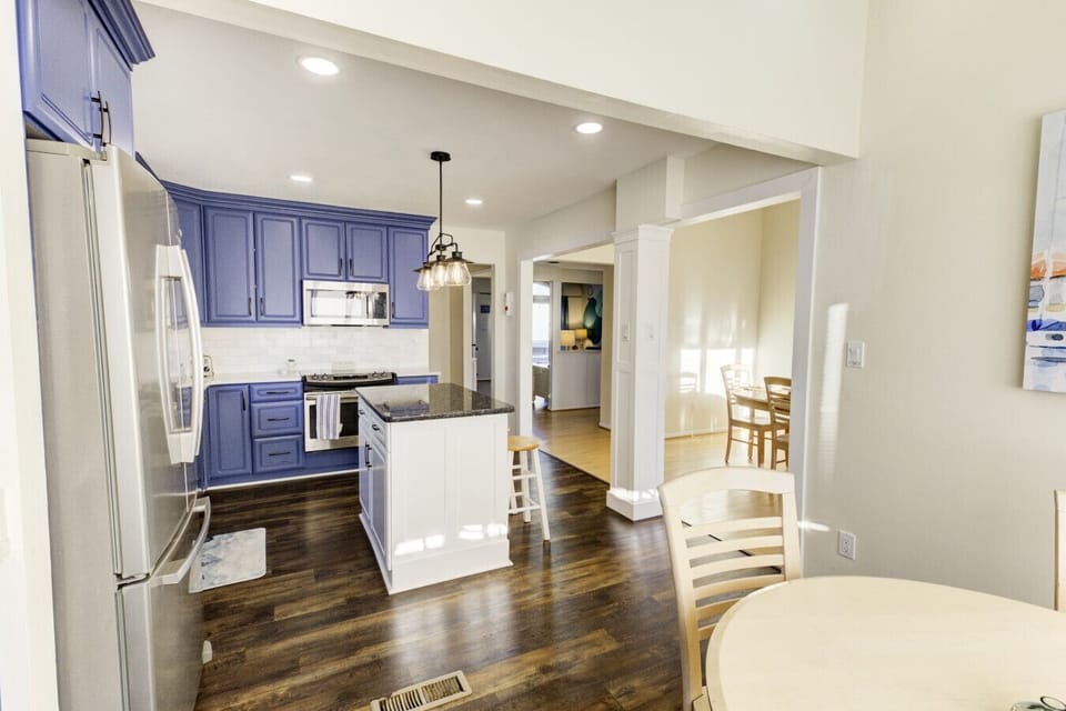 A full sized refrigerator and freezer is sure to hold food for everyone in the home.
