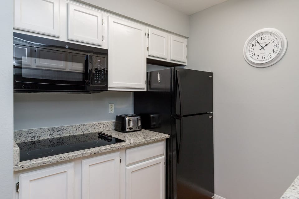 Your fully equipped kitchen awaits with granite counters, modern appliances, and everything needed for convenient meal prep during your stay.