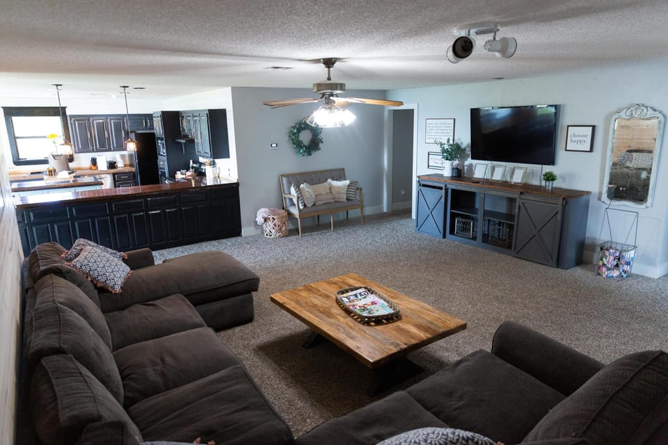 Livingroom with oversized couch with full size chaise for extra sleeping