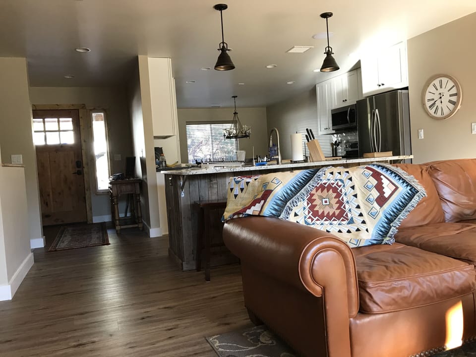 Living room with adjoining kitchen.