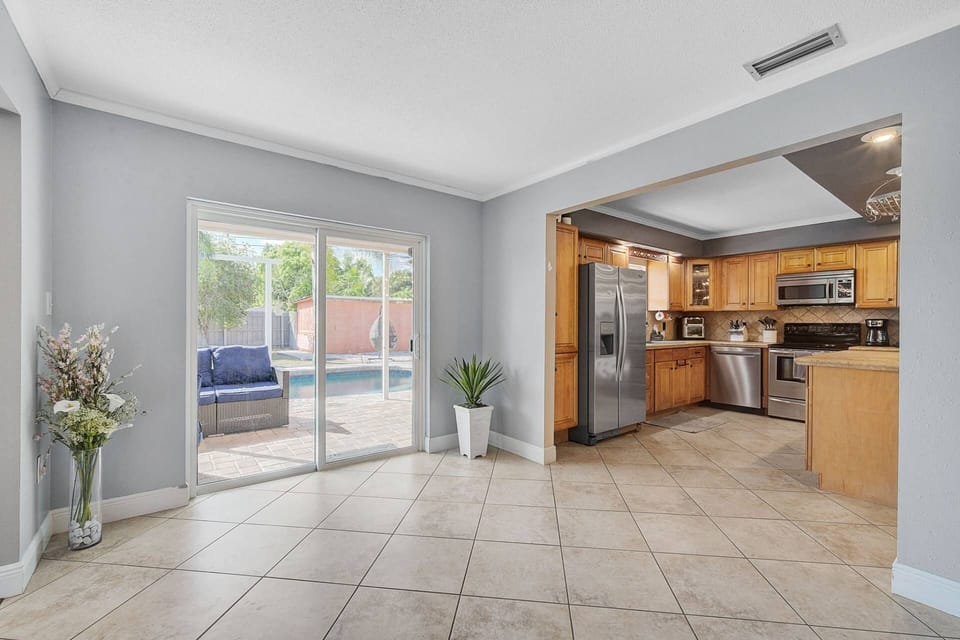 Sliding glass doors leading to the pool area