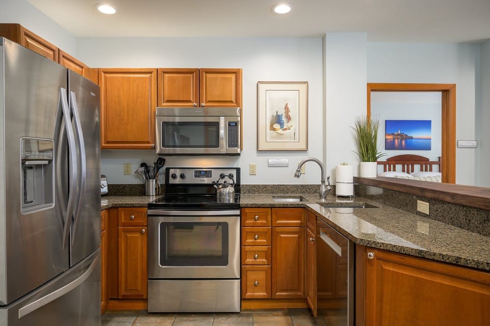 Fully stocked kitchen with stainless steel appliances