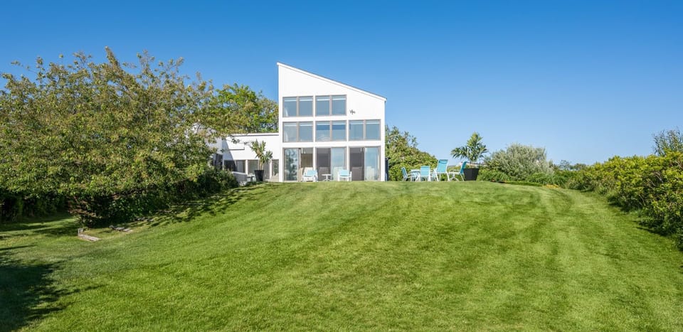 lake and lawn to house