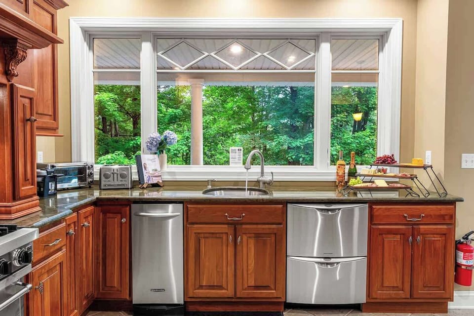 Fully equipped chef's kitchen.  Viking range & stove with 2nd stove available.  Double dishwasher, trash compactor, butchers block countertop, wet bar, granite countertops, & views of the lake!  Kitchenaid mixer, toaster, coffee makers and more.