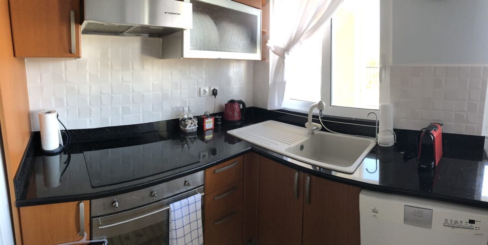 Kitchenette with stove, oven and washing machine