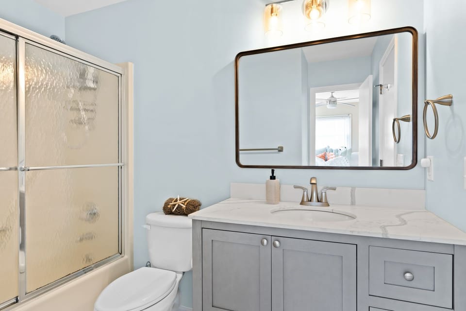 newly updated bathrooms (new floors, vanities, paint, mirror, etc.)