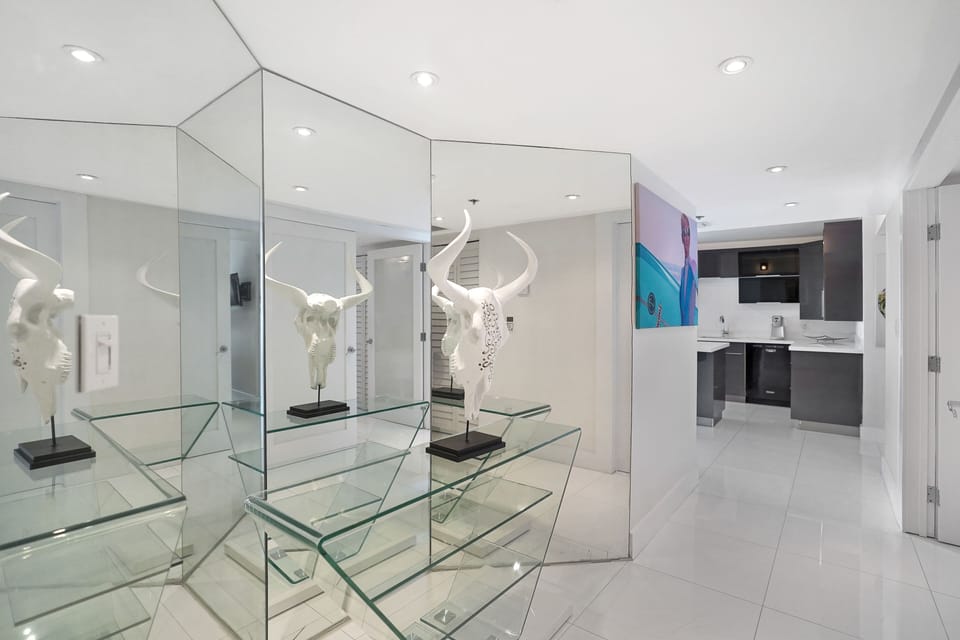 Front entry, view of fully equipped kitchen 