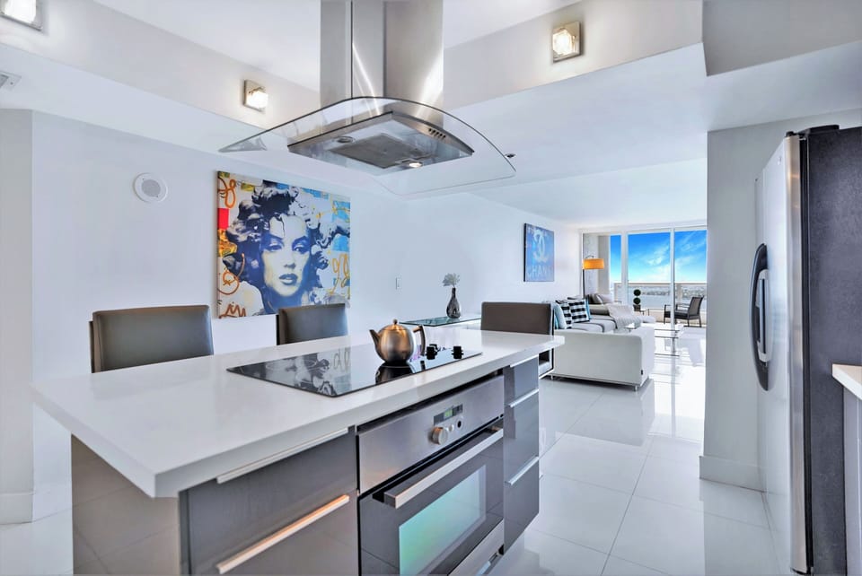 Living area, dining room, balcony access, Roku streaming tv