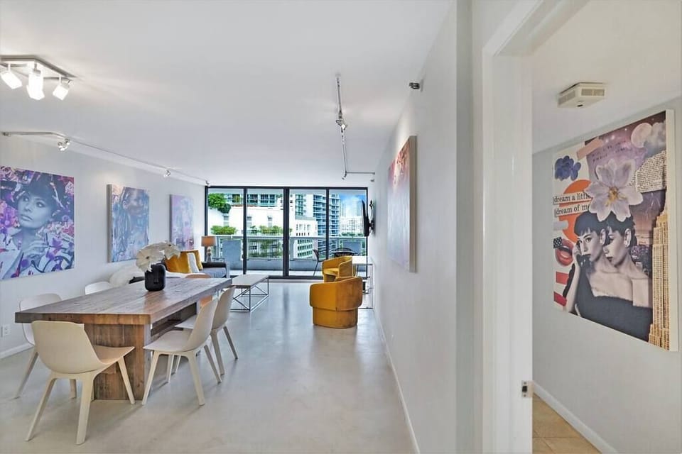 Dining/living area with view into 2nd master suite 