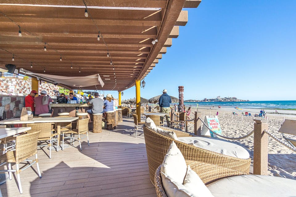 The Tiki Bar hugs the sand. A great spot for lounging, people watching, or beach volley ball.