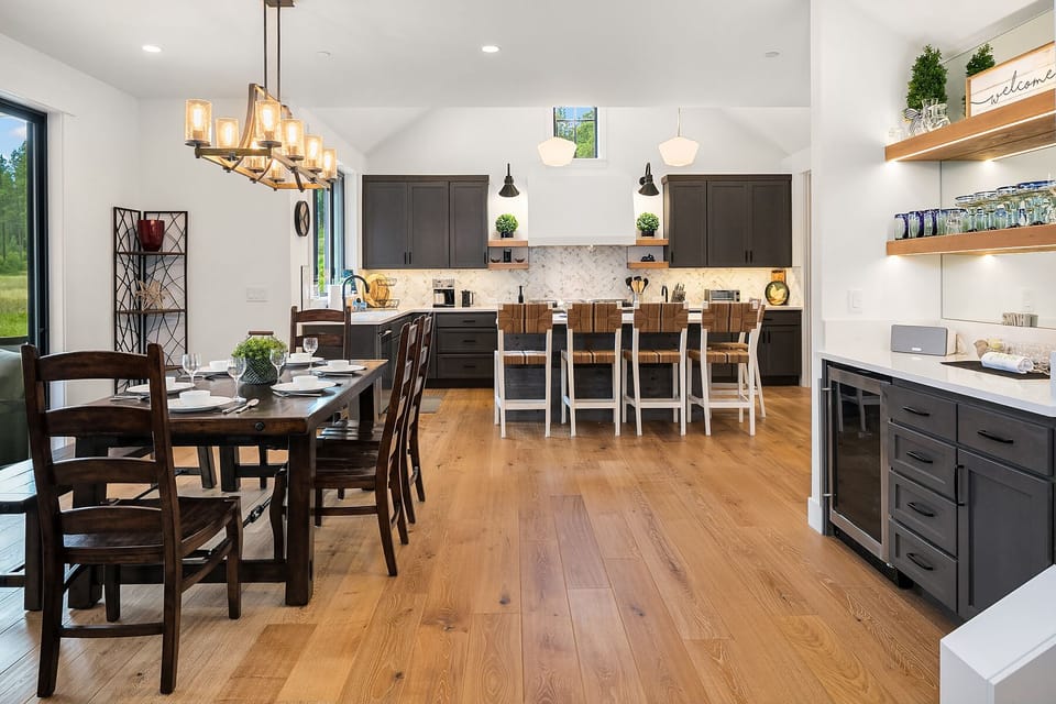 Freebird: - Dining area with seating for 8 at the table and an additional 5 at the kitchen island.