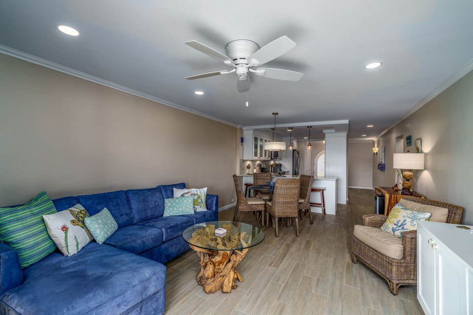 The spacious, comfy living room with cold AC, flat screen TV and balcony access.