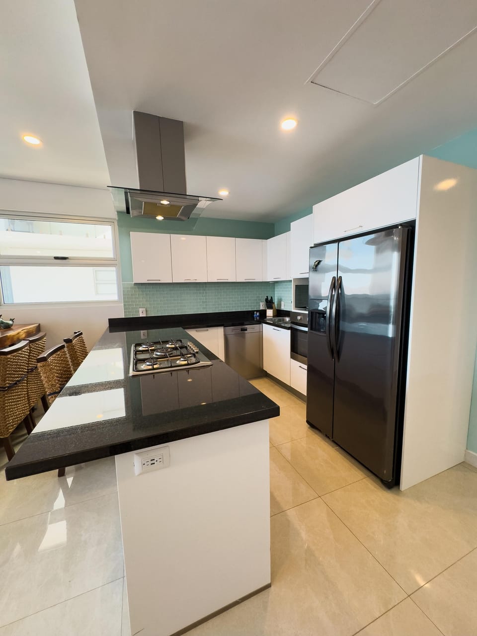 Sleek modern kitchen with spacious island and stainless appliances