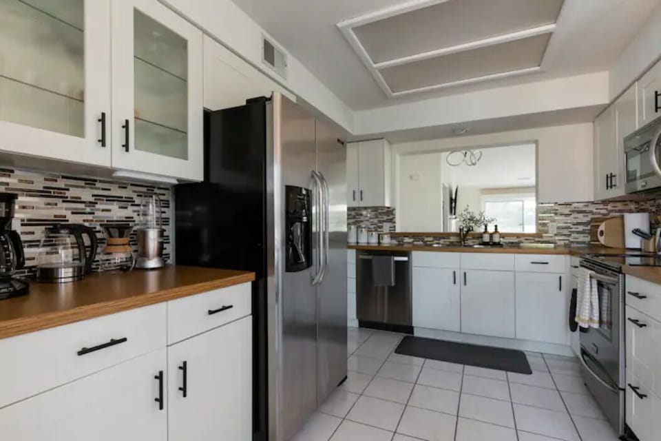 Wide and open kitchen that flows into the dining area
