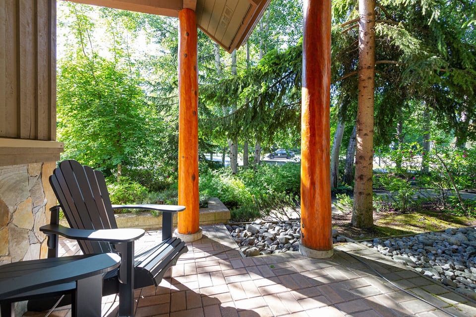 private patio with Adirondack chairs