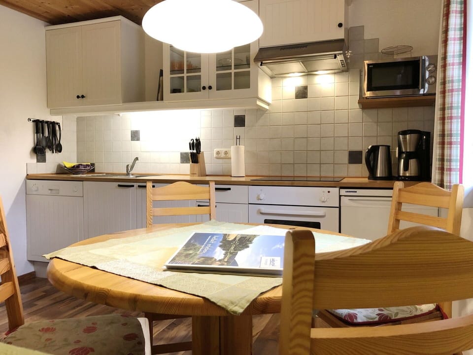 Cabinetry, Furniture, Property, Countertop, Table, Wood, Chair, Kitchen Stove, Kitchen Appliance, Kitchen