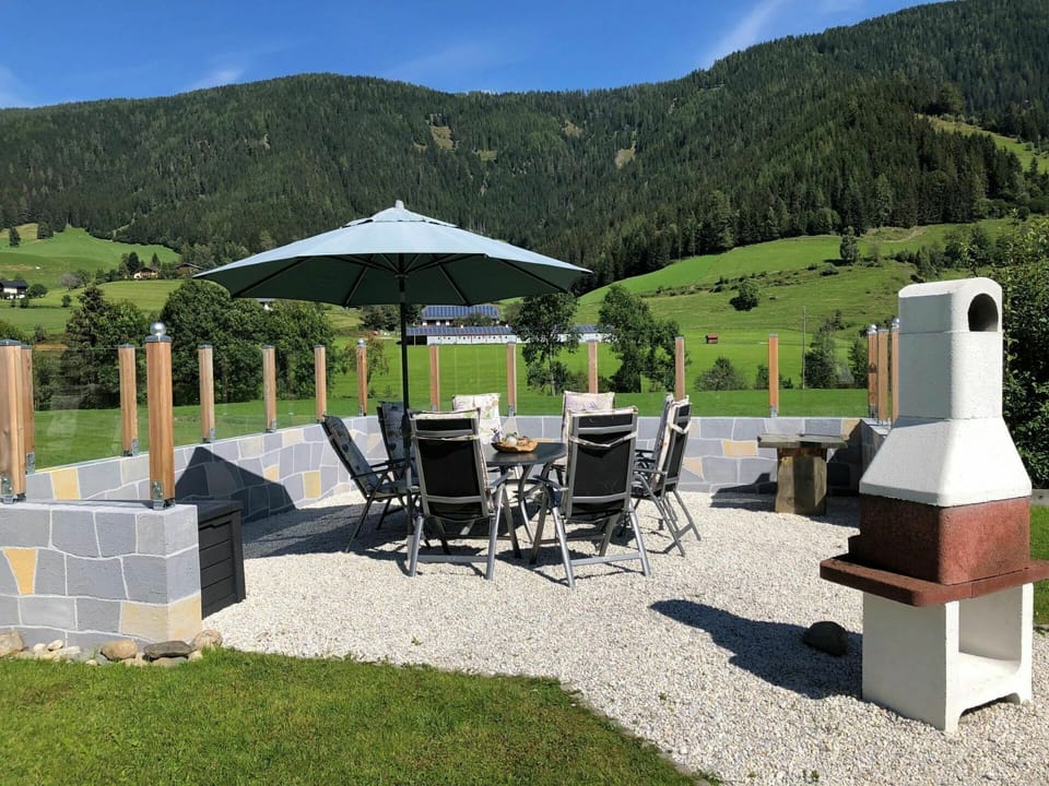 Sky, Property, Mountain, Plant, Nature, Building, Tree, Shade, Botany, Outdoor Furniture