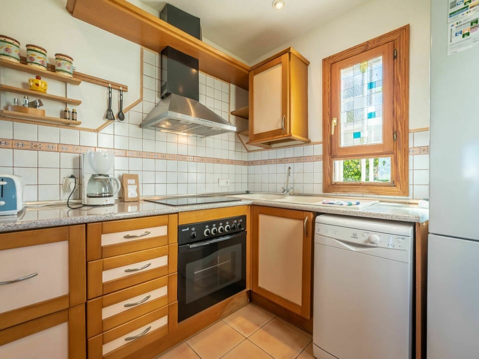 Cabinetry, Countertop, Building, Furniture, Kitchen Stove, Kitchen Appliance, Kitchen, Wood, Home Appliance, Lighting