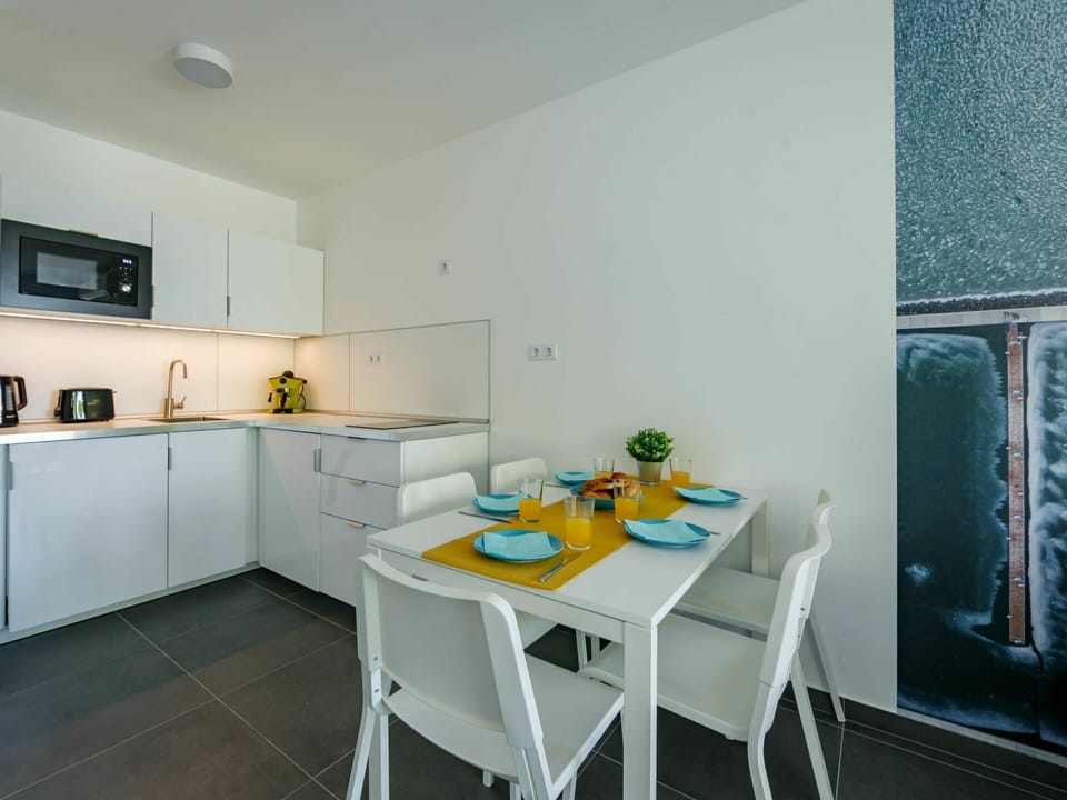 Furniture, Property, Table, Cabinetry, Building, Kitchen, Interior Design, Countertop, Flooring, Shelving