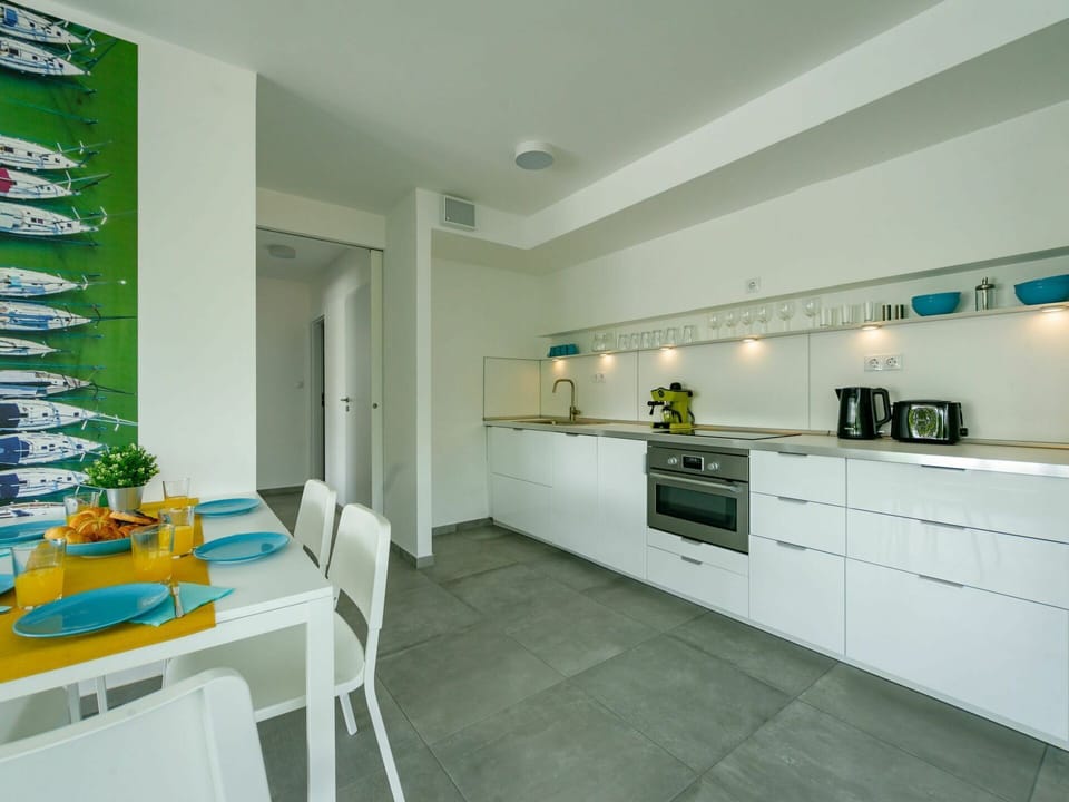 Cabinetry, Countertop, Furniture, Property, Building, Table, Kitchen Appliance, Chair, Kitchen Stove, Kitchen