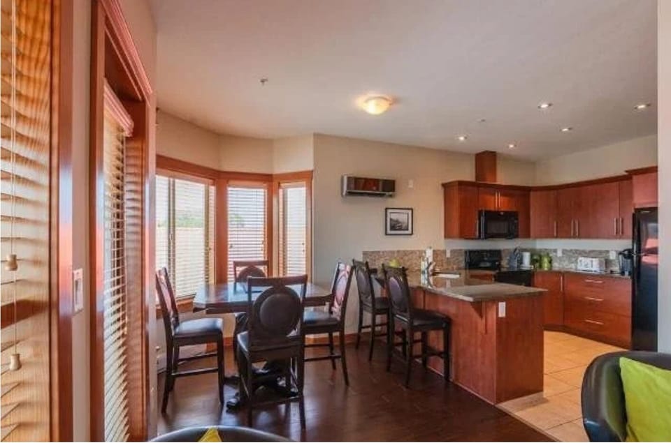 Dining table extends and seats 4, the island seats 2.