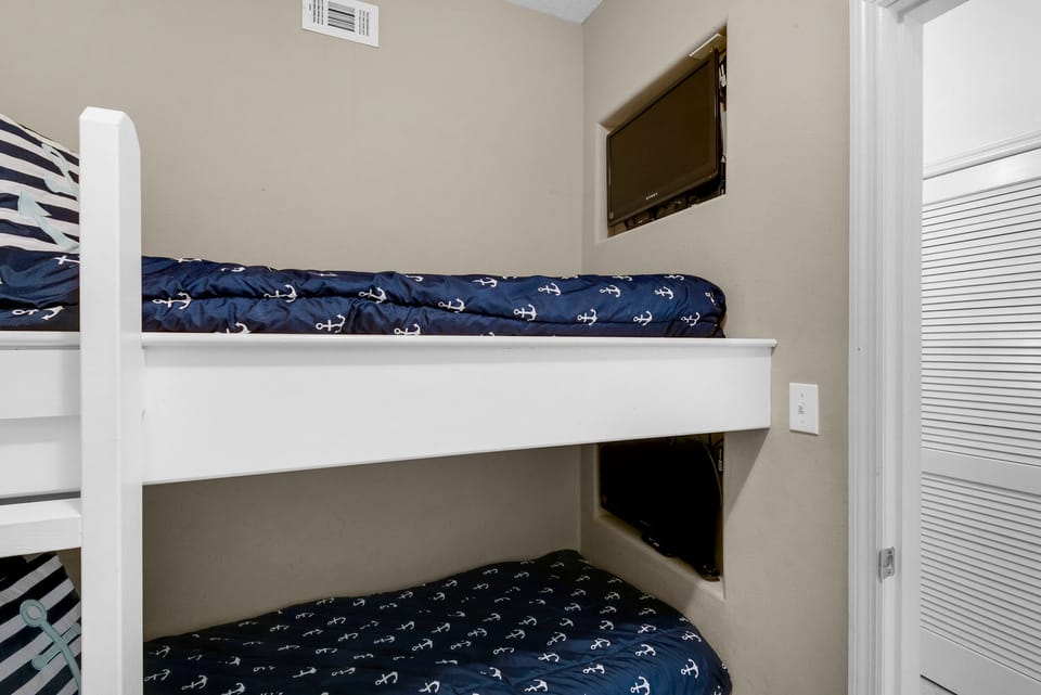 Bunk room with 2 TVs