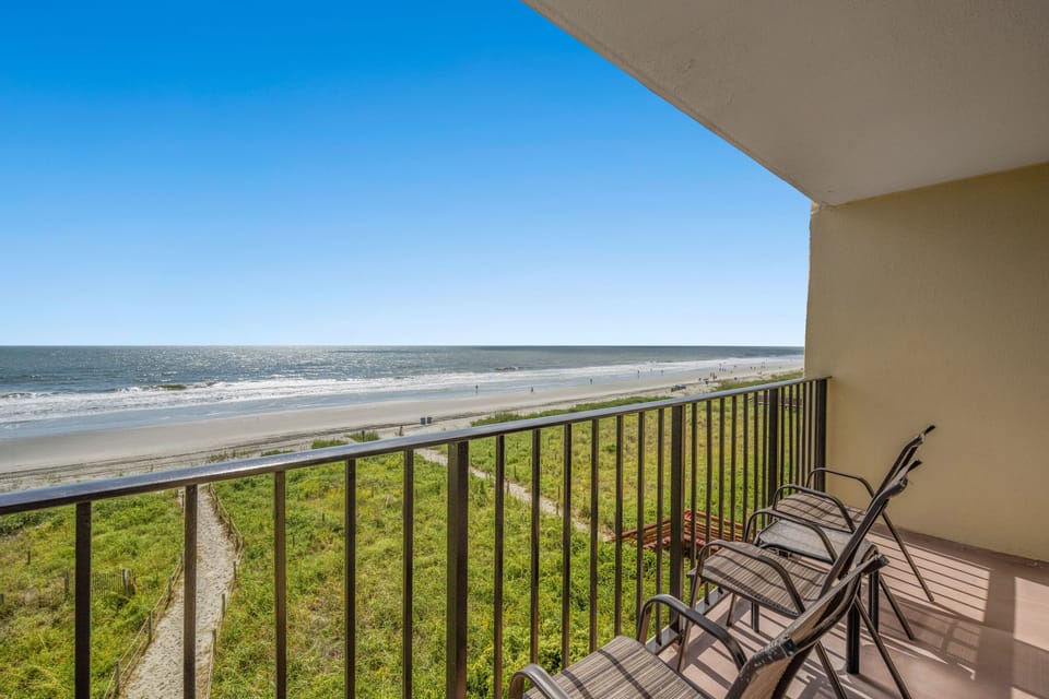 Sit down with your favorite drink while watching the waves.