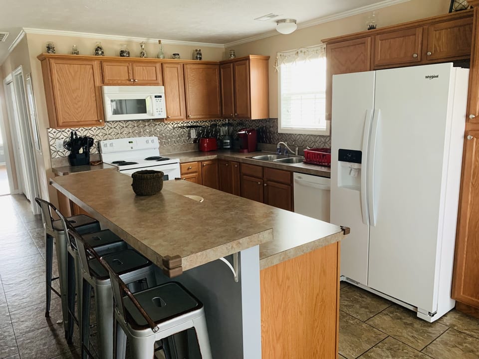 Fully equipped kitchen with air fryer, regular coffee maker, & Keurig machine. 
