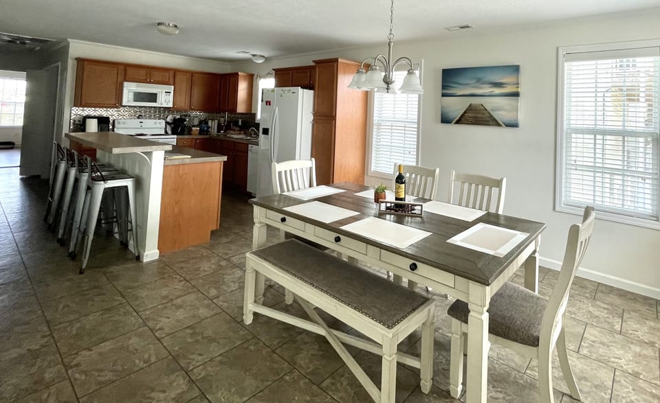Room for eating at the dining room table or kitchen island.