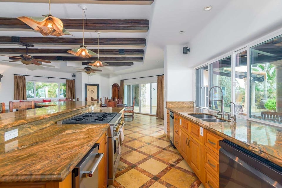 Spacious kitchen with ocean breeze and open layout for seamless cooking.
