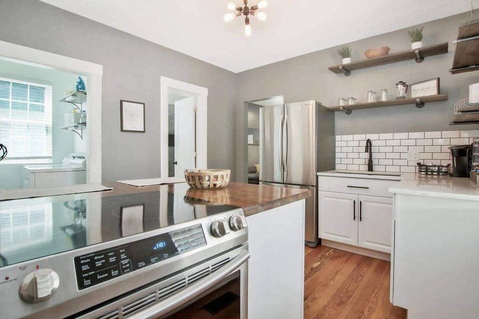 Updated Kitchen with Quartz countertops and large Stainless Steel Refrigerator, Slide in Stove and walk-in Pantry