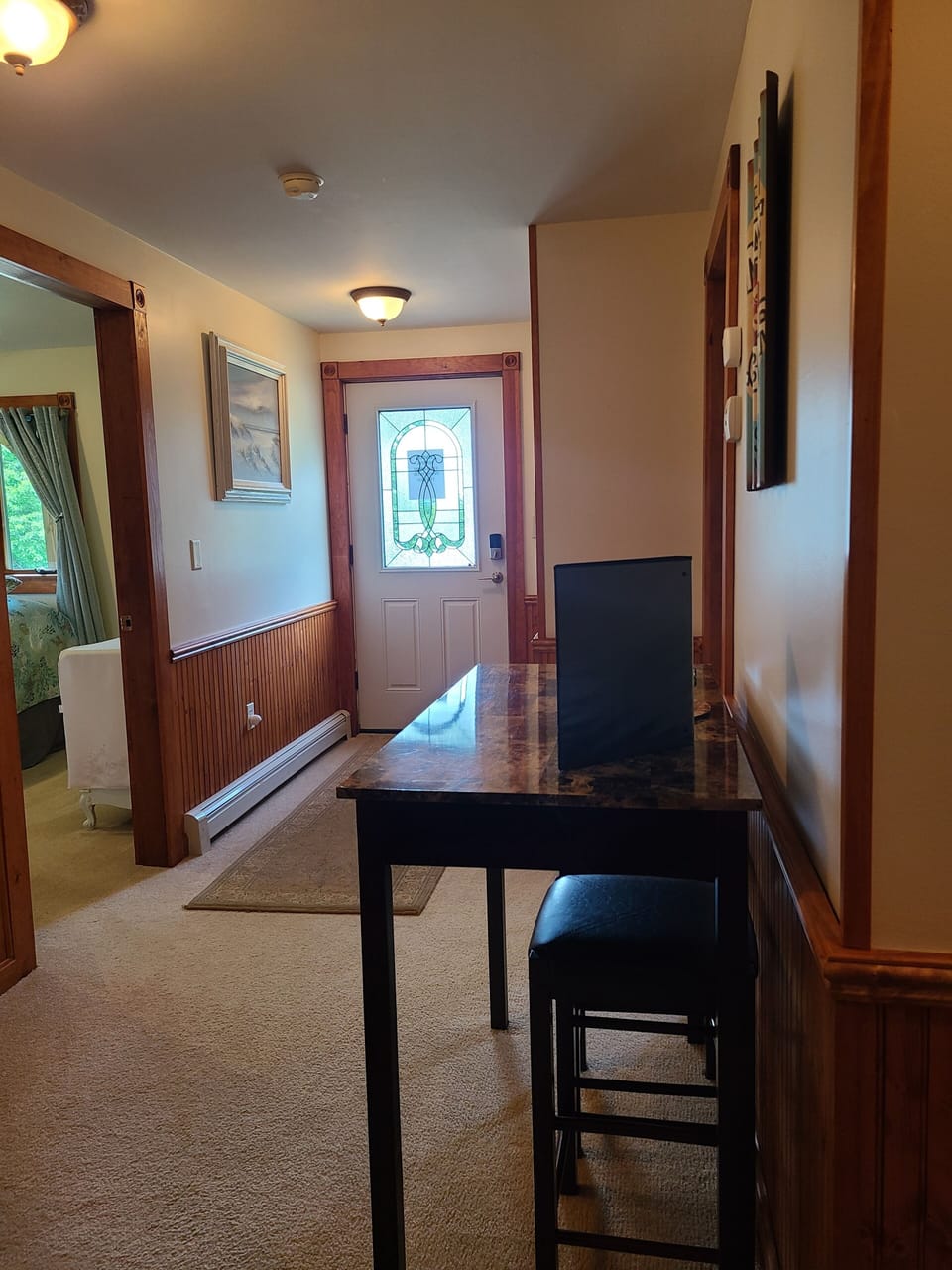 View from Kitchenette towards Entrance. BR 1 on left. BR 2 on right.