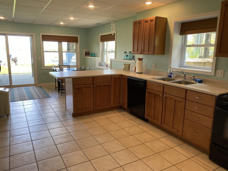 Lower level kitchen. Stove, oven, microwave, dishwasher, refrigerator/freezer