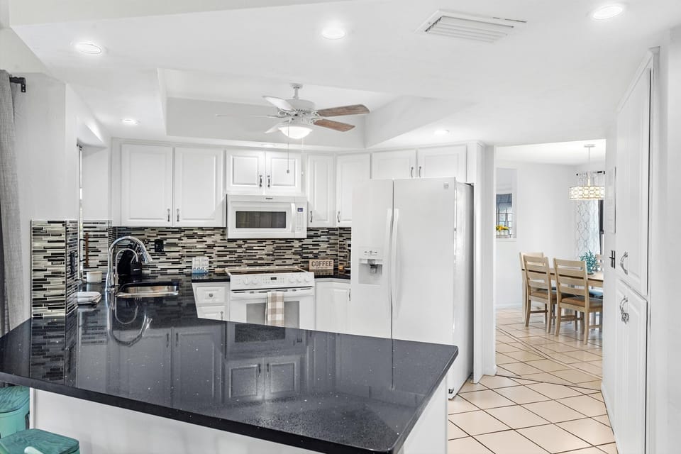 The kitchen provides everything you need to cook a delicious meal from pots, pans, measuring cups, mixing bowls, knives, cutting boards etc. There is a blender and toaster as well!