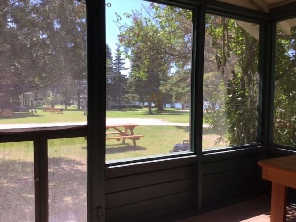 Full screened in front porch with water views