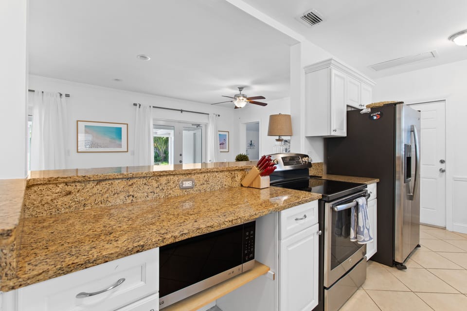 Kitchen over looks the dining area and living space.