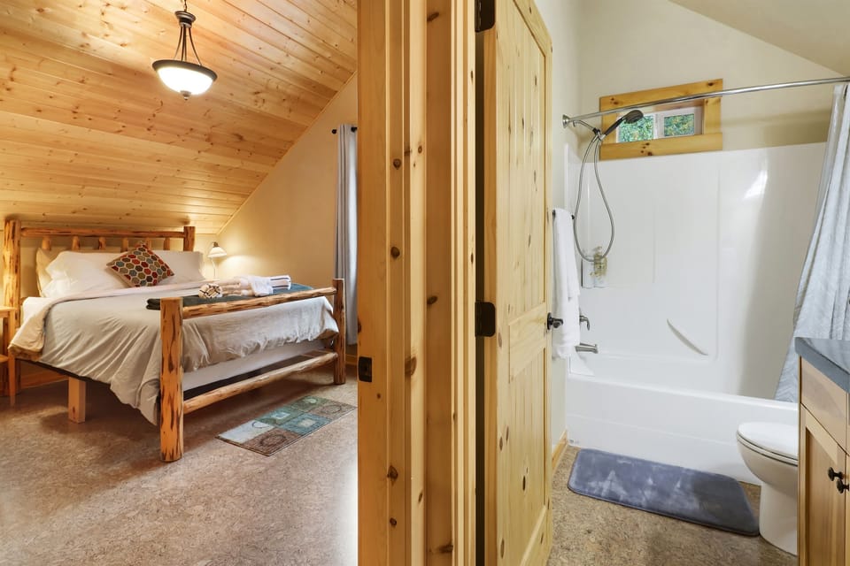 Full bathroom with tub next to the bedroom upstairs (now upgraded to a King bed!)