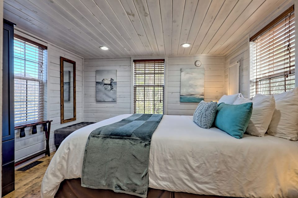 Bright shiplap bedroom with plush bedding and serene coastal touches