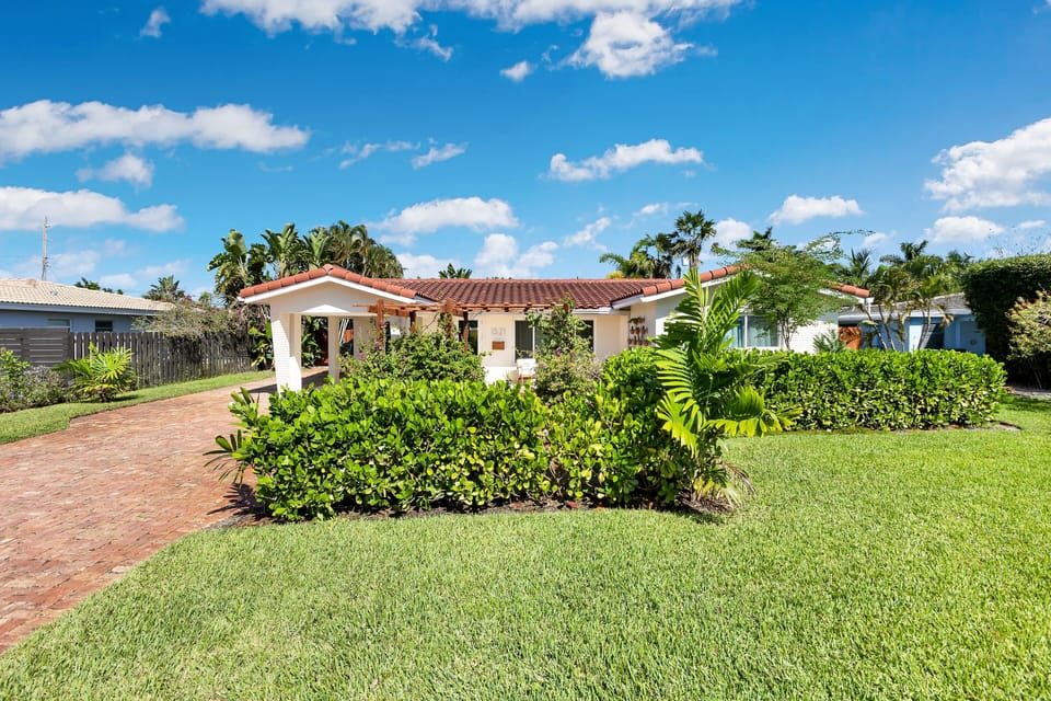Mediterranean vibe with tall shrubs that offer privacy 
