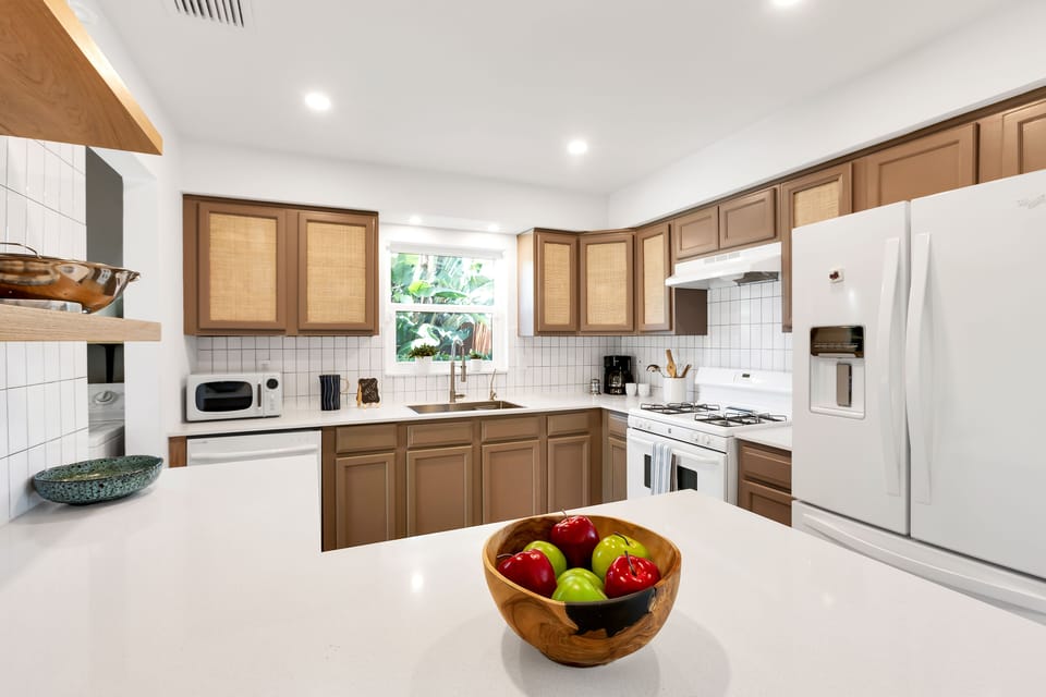 Kitchen has a gas stove and is well stocked 