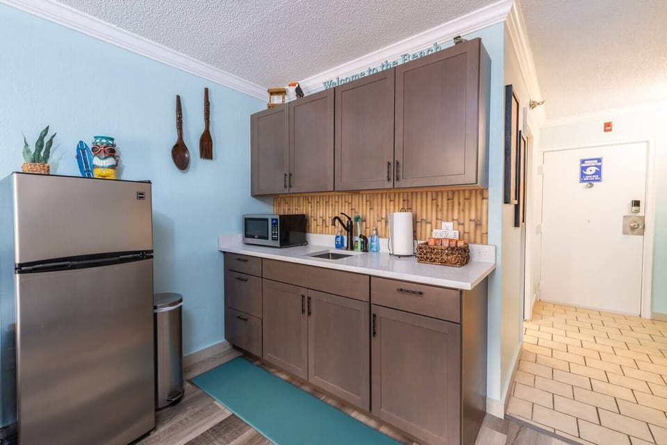 Remodeled Kitchen with Quartz Counters and a surprise tropical touch