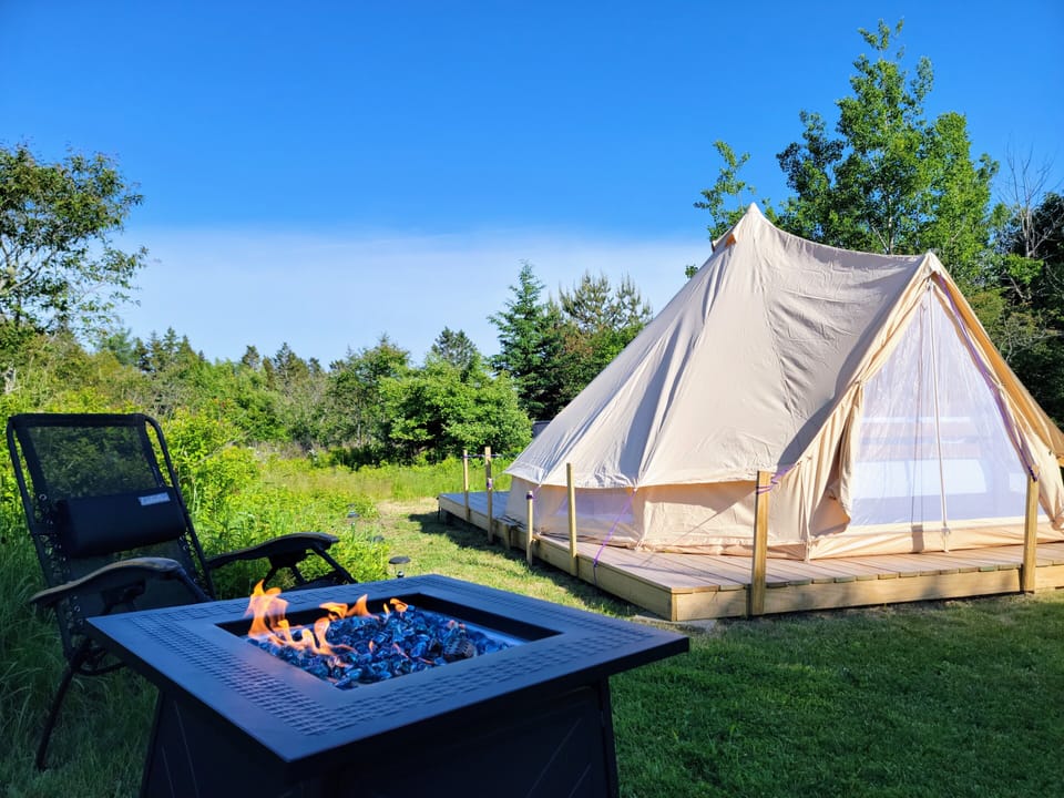 Fire pit for your private use. The shower is on the other side of the tent.