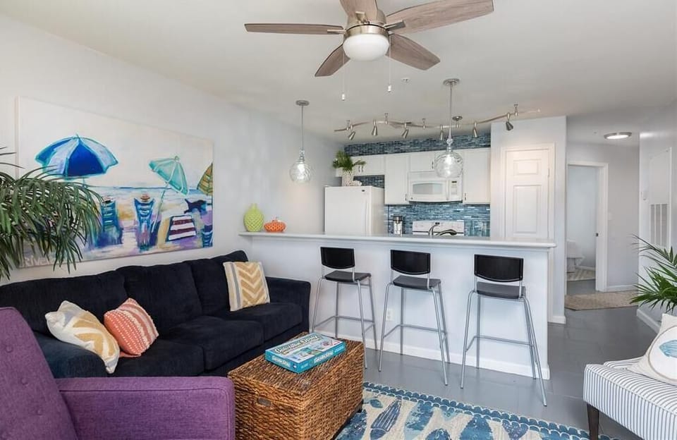 Bright white kitchen and dining bar.