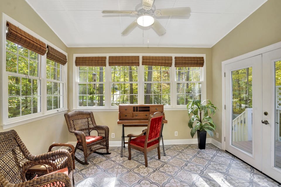 Beautiful Sunroom with Laptop Workspace